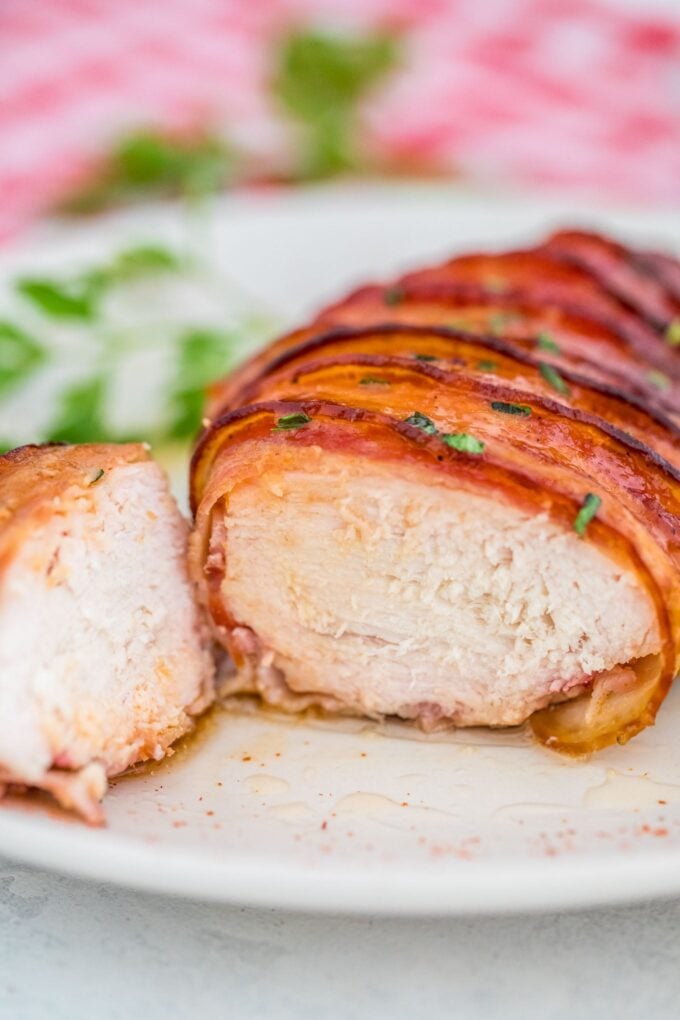 sliced chicken breasts wrapped in bacon