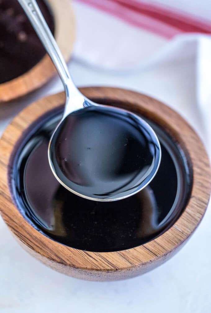 a spoonful of balsamic reduction from a dipping bowls