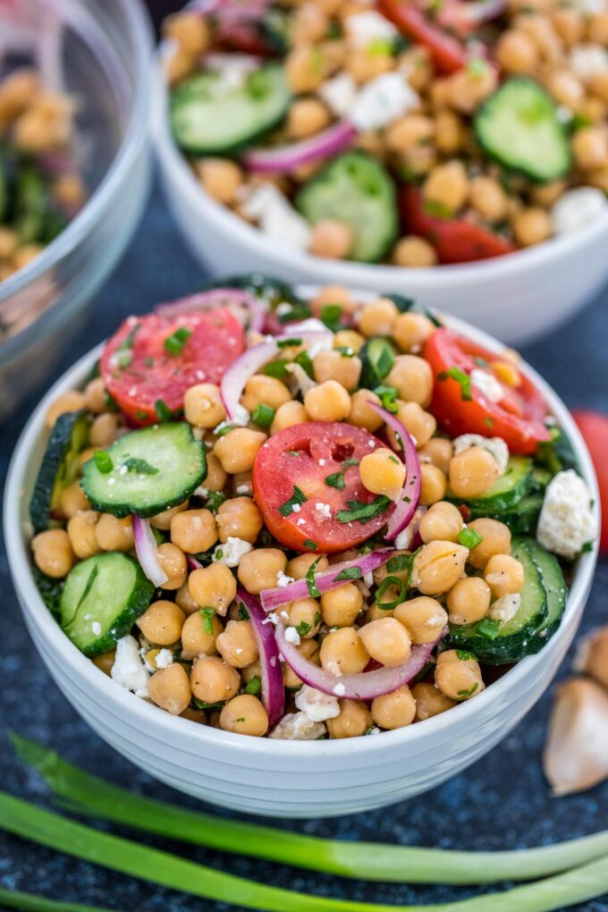 Freshly made chickpea Salad in a large white bowl. 