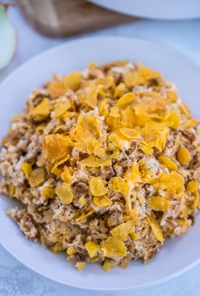 Easy hashbrown casserole with corn flakes on a white plate