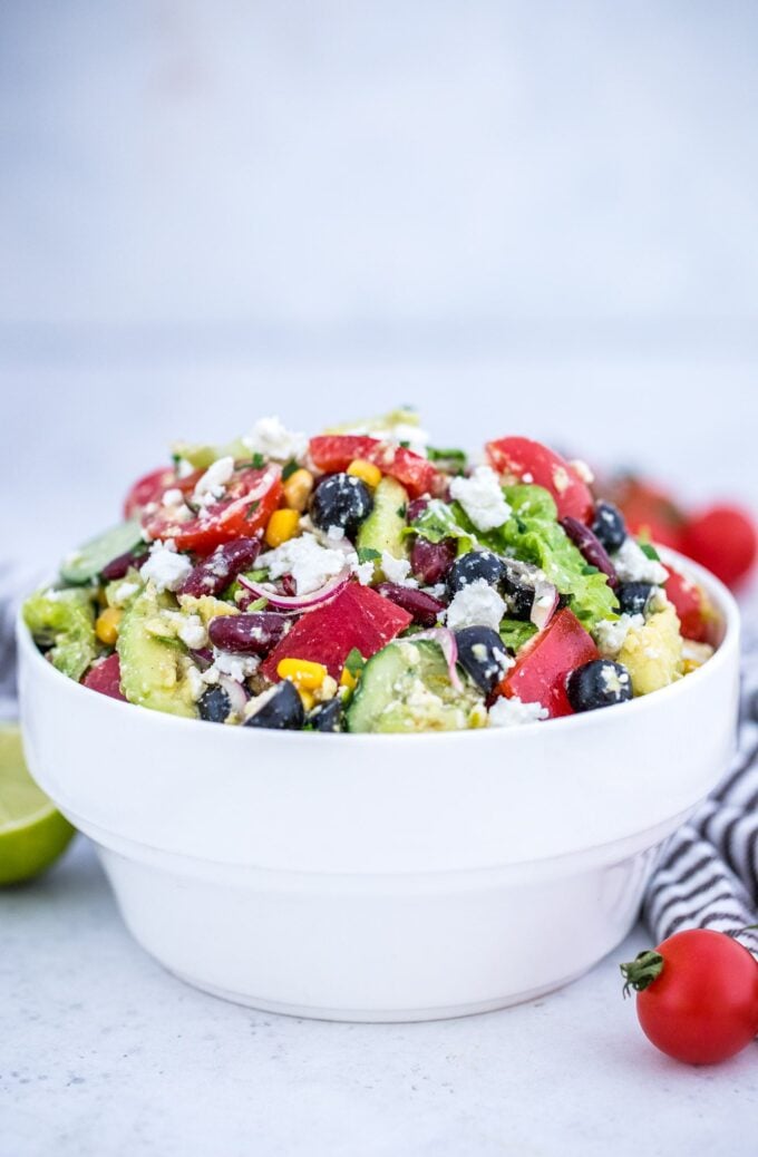 Chopped Mexican salad topped with cotija cheese in a bowl