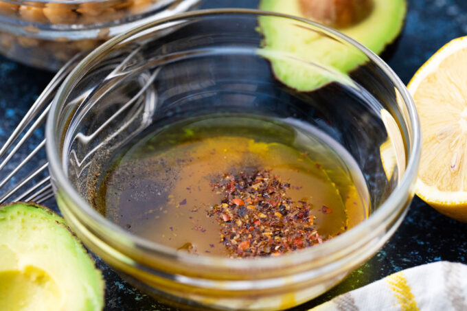 Olive oil based dressing in a bowl.