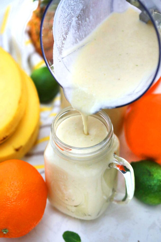 Photo of tropical smoothie in a blender.