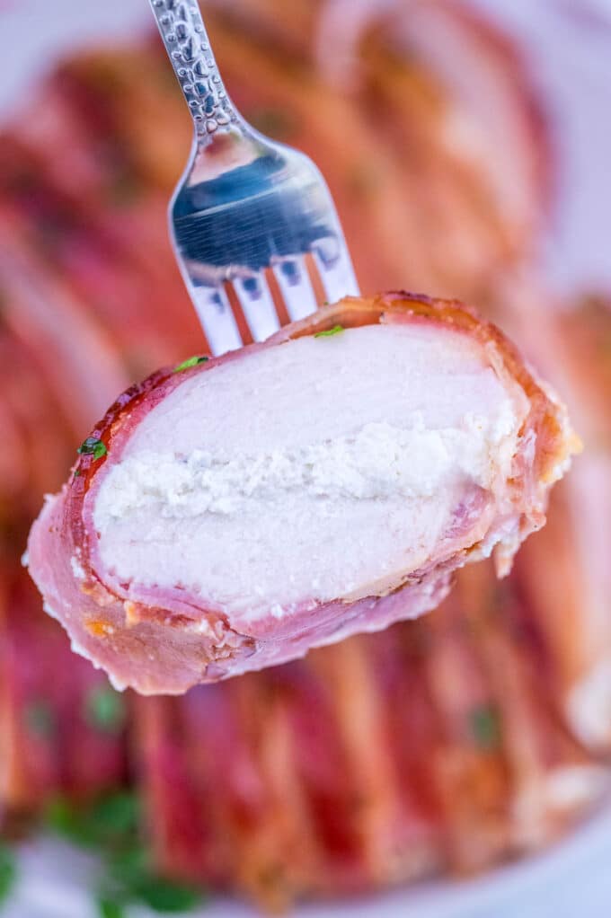 Picture of sliced bacon wrapped chicken breast.
