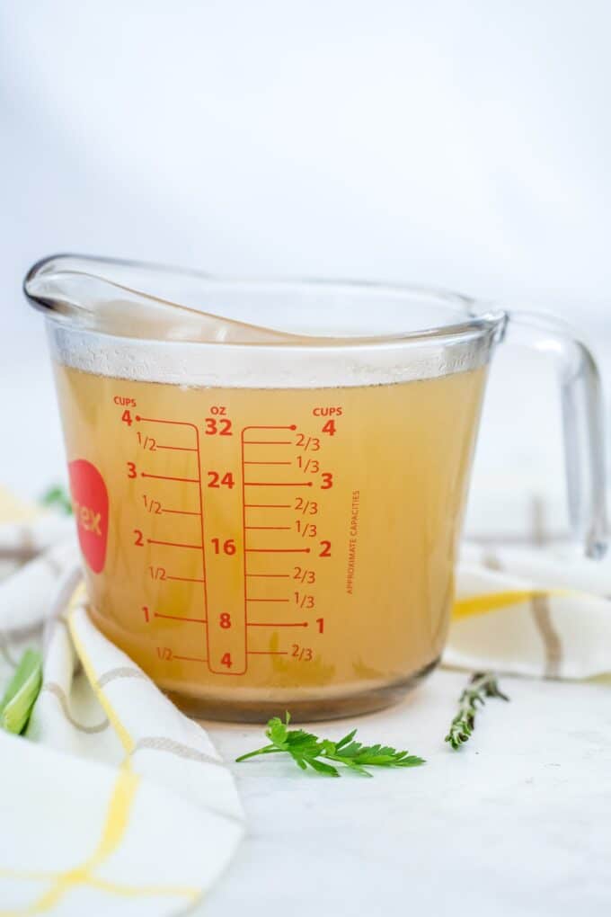 Freshly made chicken stock in a cup