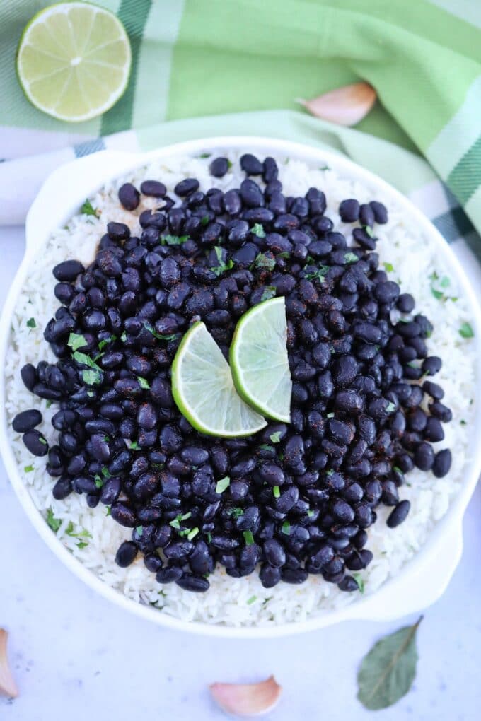 Image of chipotle black beans over white rice on a plate.