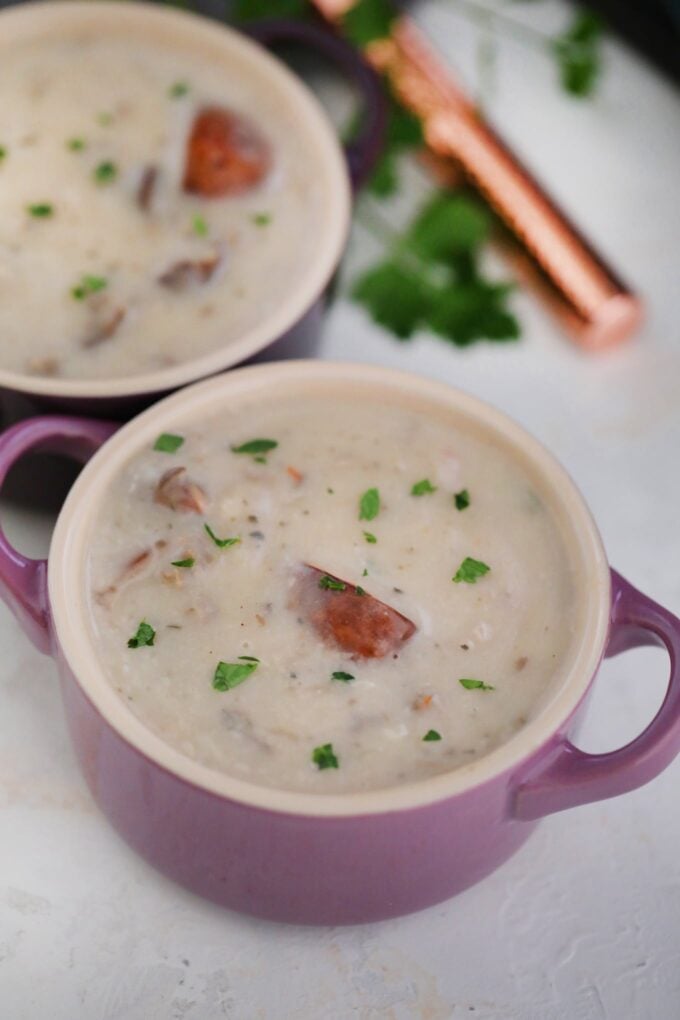 Quick and easy cream of mushroom soup garnished with chopped green onion in a bowl