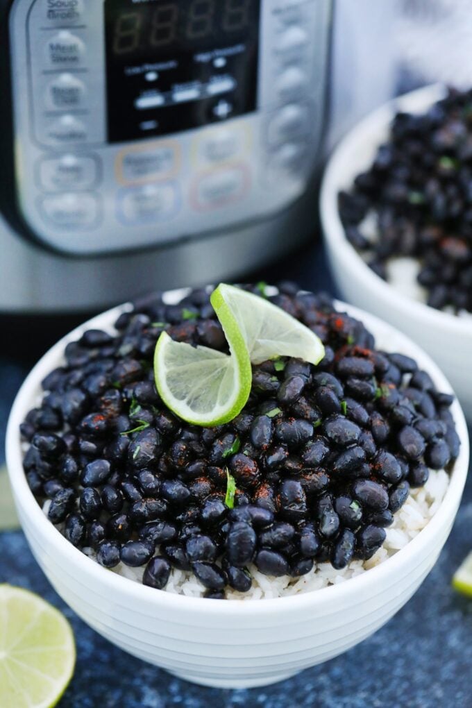 Instant Pot Black Beans on top of bowls of rice