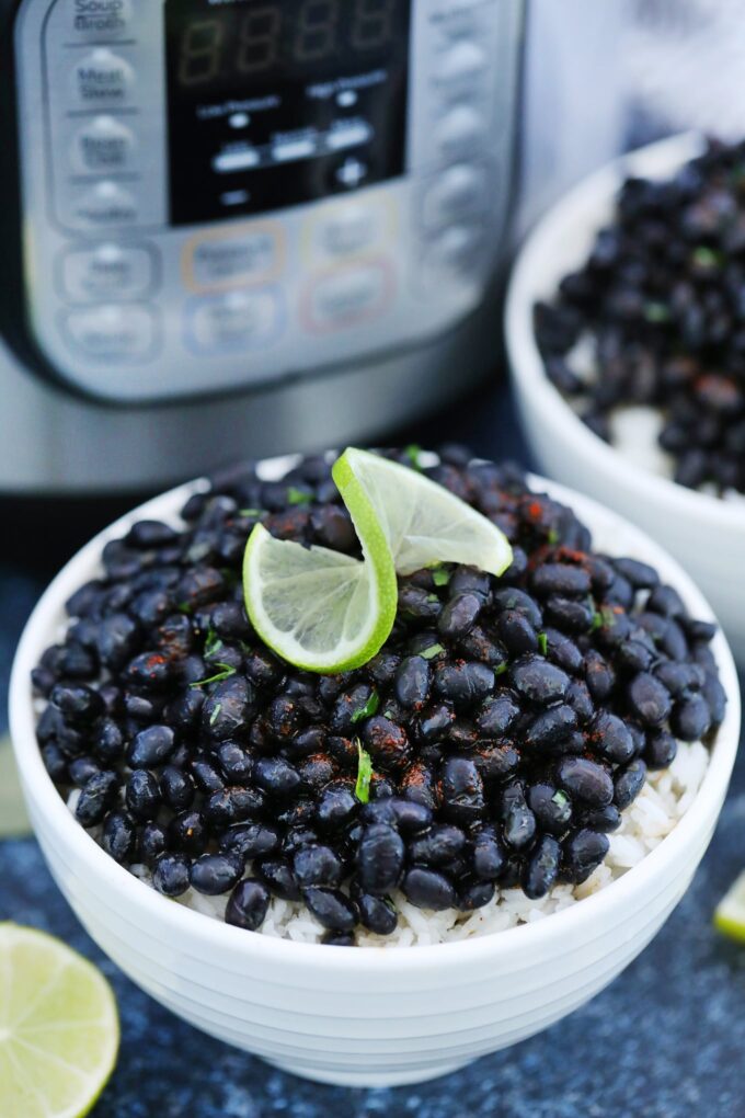 Instant Pot Black Beans on top of bowls of rice