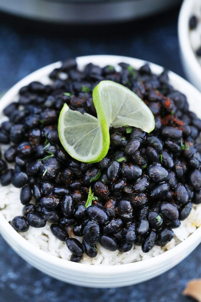 bowl of rice with black beans and lime