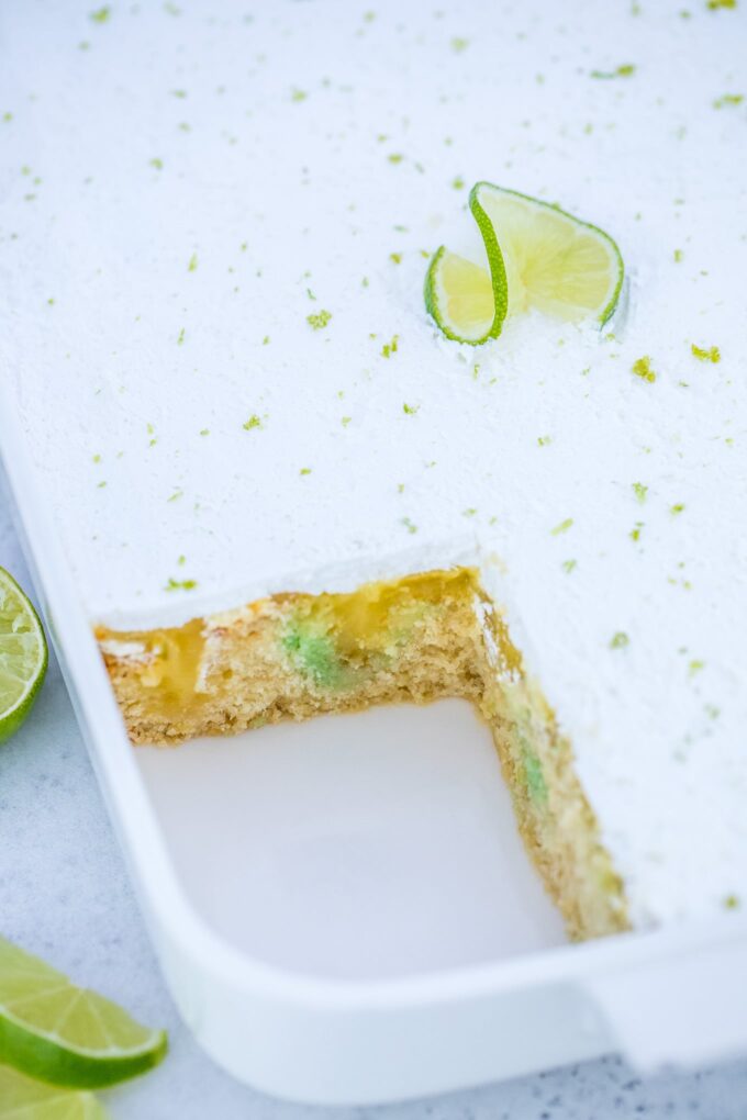 Photo of homemade key lime pie poke cake in a baking dish.