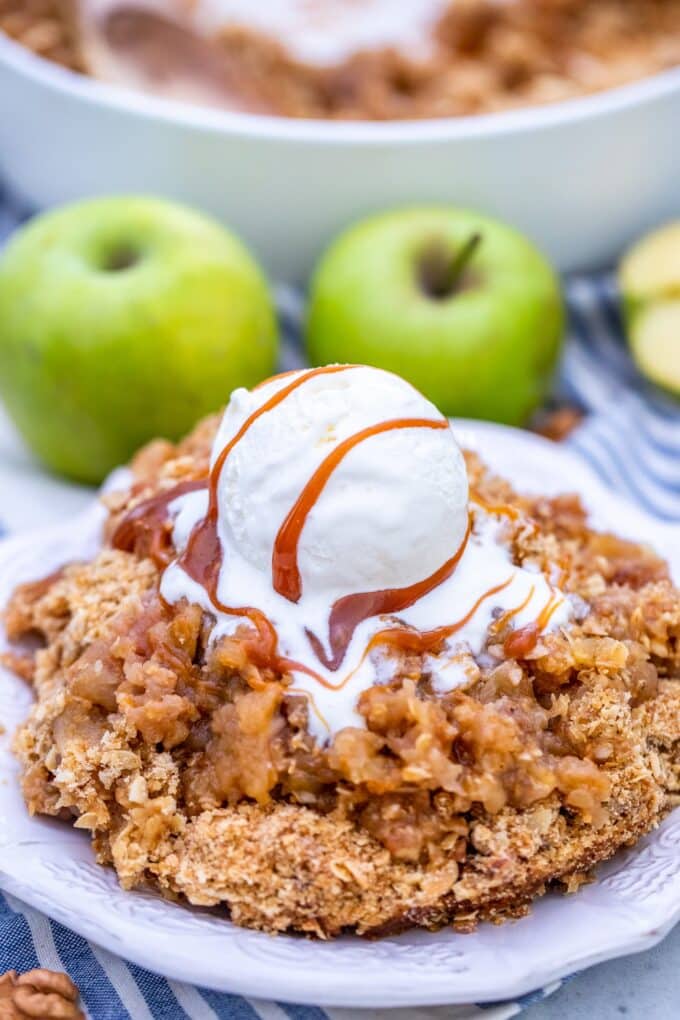 Classic Apple Crumble topped with ice cream and caramel sauce