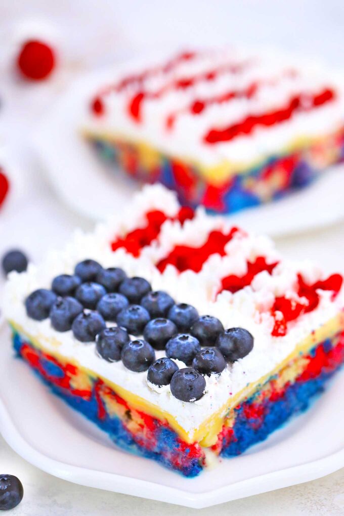 a slice of red white and blue Patriotic Poke Cake