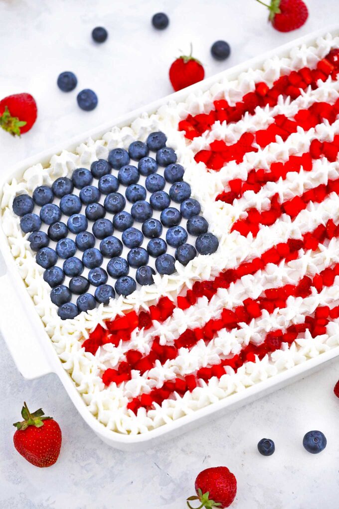 Patriotic Poke Cake with fresh strawberries and blurberries