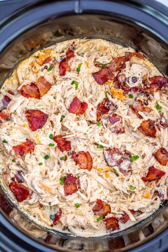 Slow cooker crack chicken topped with bacon
