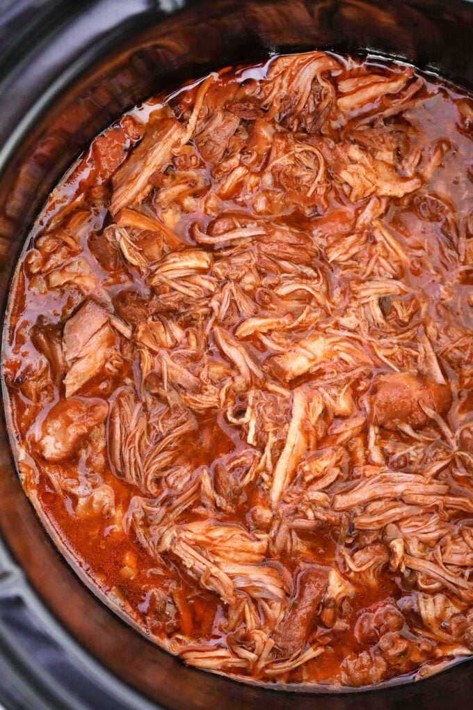 Shredded pulled pork cooked in the slow cooker with spices 