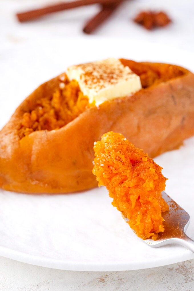 Fluffy and creamy Instant Pot sweet potato topped with butter.