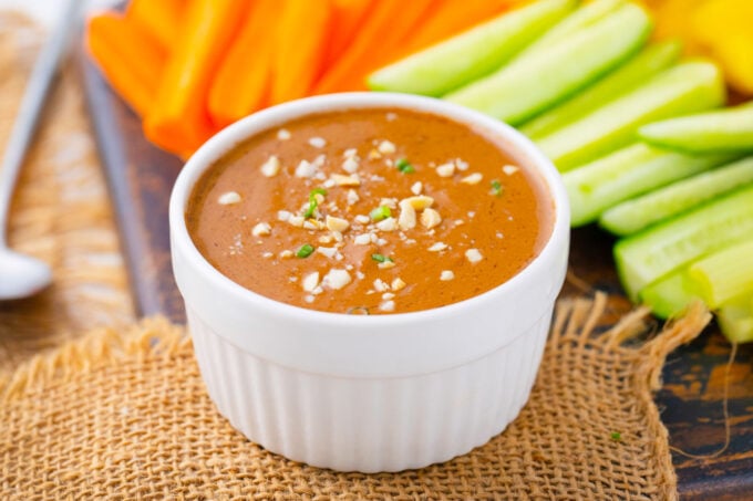 Creamy peanut butter sauce served with veggies.