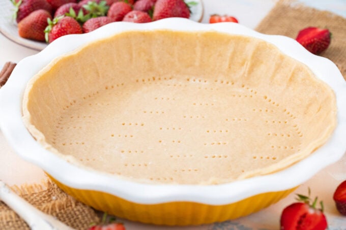 Pie dough in a pie dish.