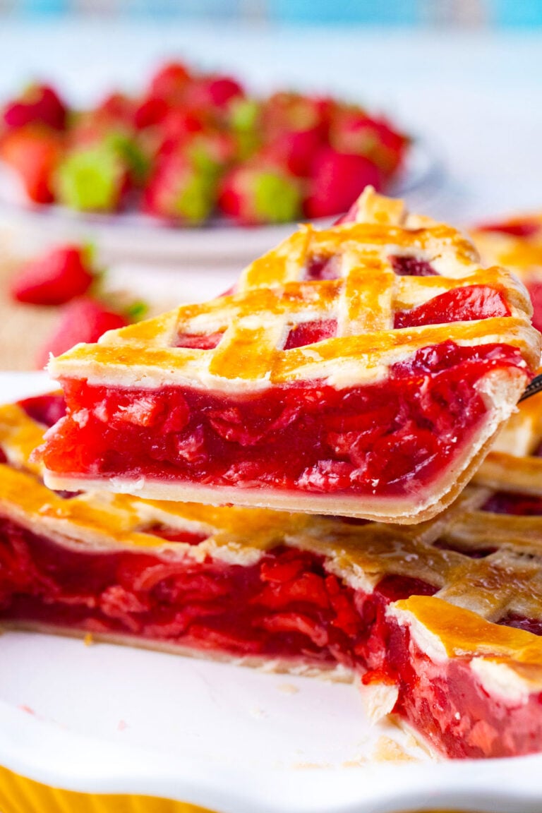 A slice of strawberry pie on a serving spatula.