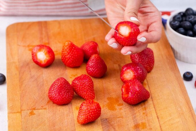 Hulling fresh strawberries.