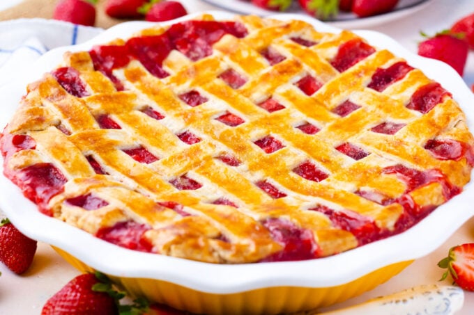 Homemade strawberry pie with lattice top.