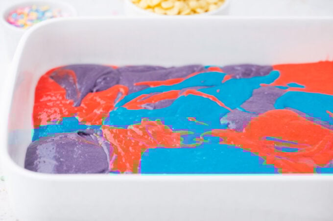 Baking colorful unicorn poke cake.