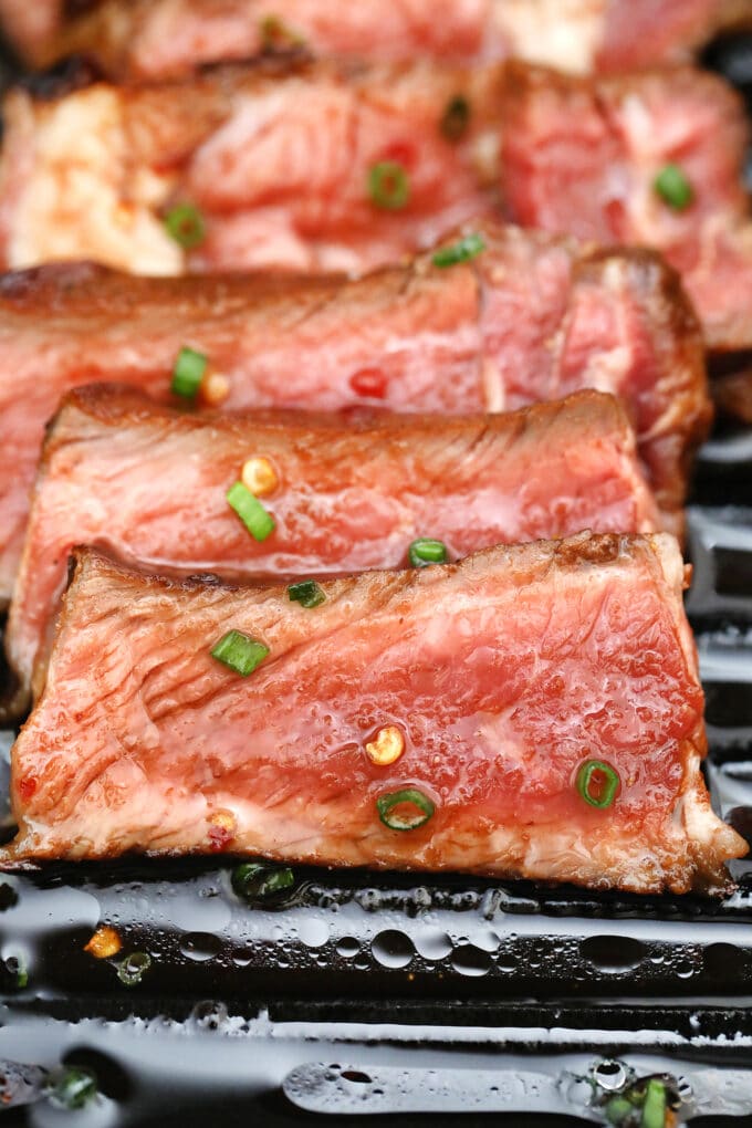 sliced grilled steak topped with homemade Asian marinade.