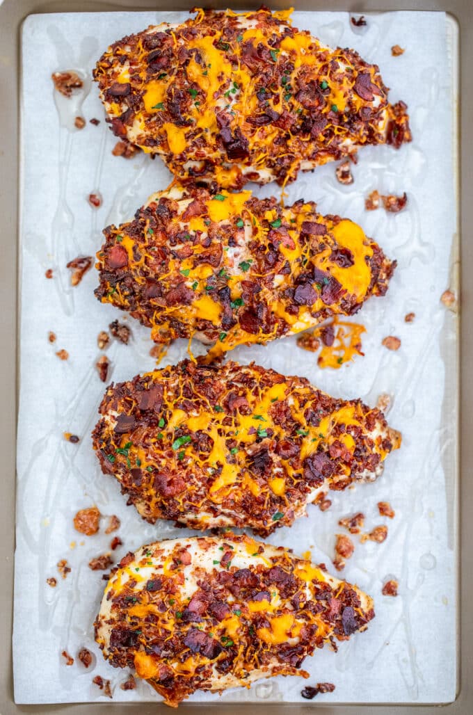 Image of baked crack chicken breasts topped with bacon and cheese. 