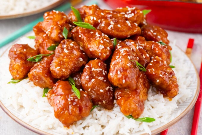 Asian honey sesame chicken over white rice.