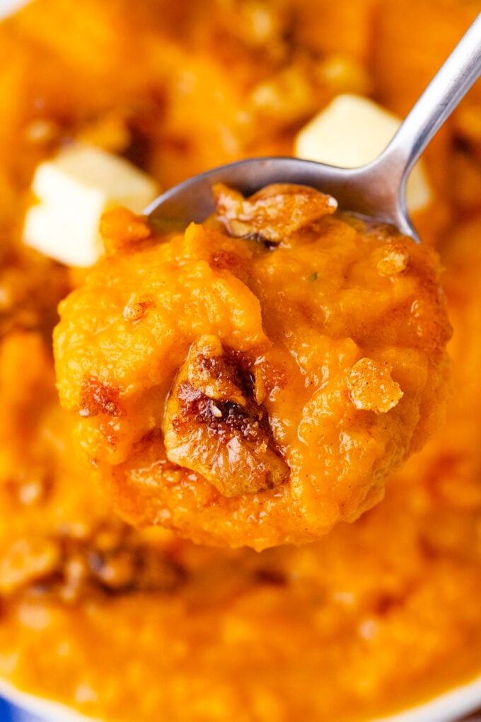 A spoonful of fluffy mashed sweet potatoes.