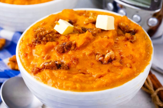Tender crockpot mashed sweet potatoes with butter.