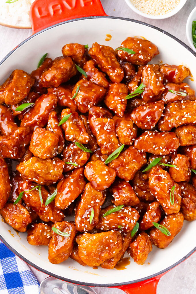 A skillet of Asian honey sesame chicken.