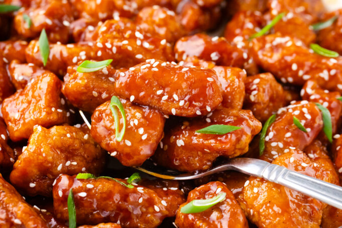 A spoonful of homemade Asian honey sesame chicken.