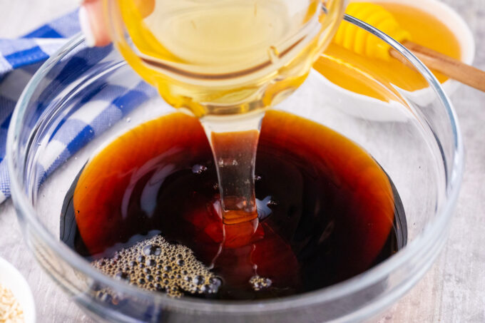 Mixing the ingredients for honey sesame sauce.