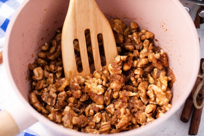 Pecans, butter and sugar in a saucepan.