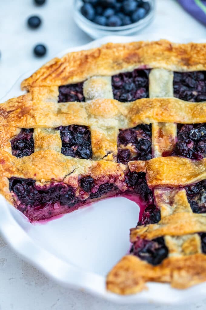 sliced lattice Blueberry Pie revealing a juicy blueberry filling