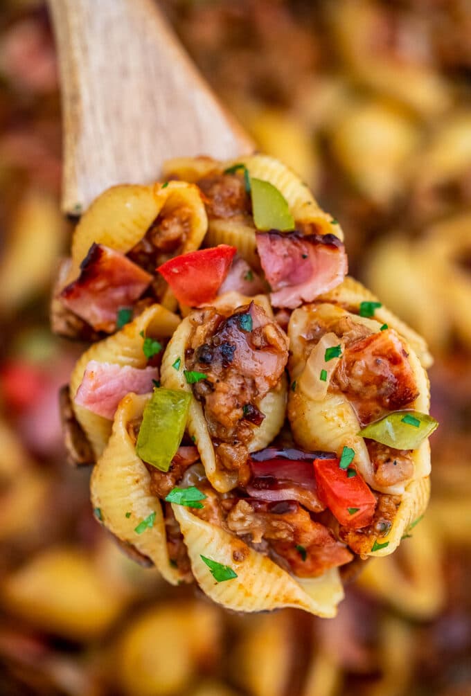 Homemade cheeseburger pasta on a wooden spoon