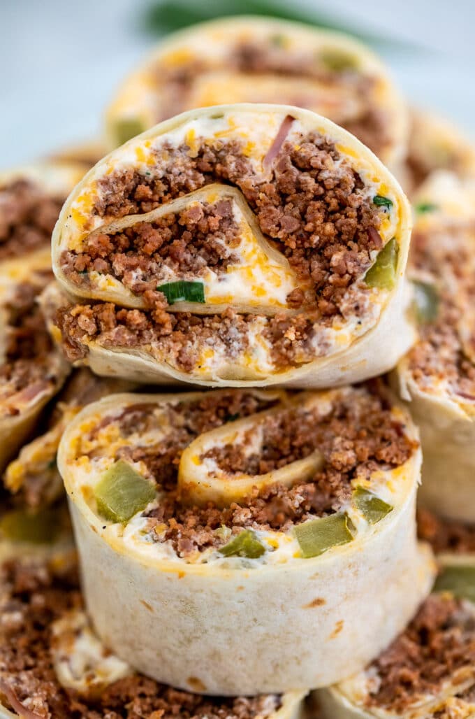 Cuban Sausage Pinwheels are great for parties or lunchboxes! Serve this dish as an appetizer or simple snack that is loved by both kids and adults alike! #sausage #lunchbox #lunchideas #sweetandsavorymeals #fingerfood