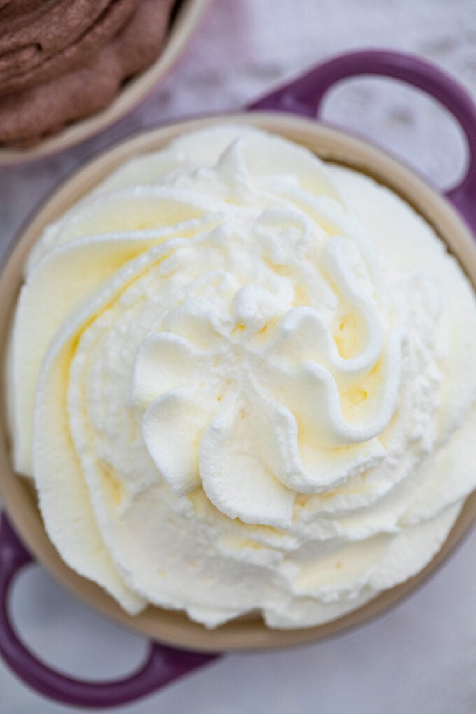 Whipped Cream is sweet, fluffy, and smooth! Learn how to make it at home using minimal ingredients. #whippedcream #cream #frosting #desserts #sweetandsavorymeals