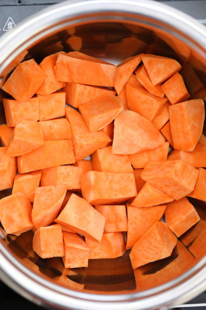 Picture of sliced sweet potatoes in a pot. 