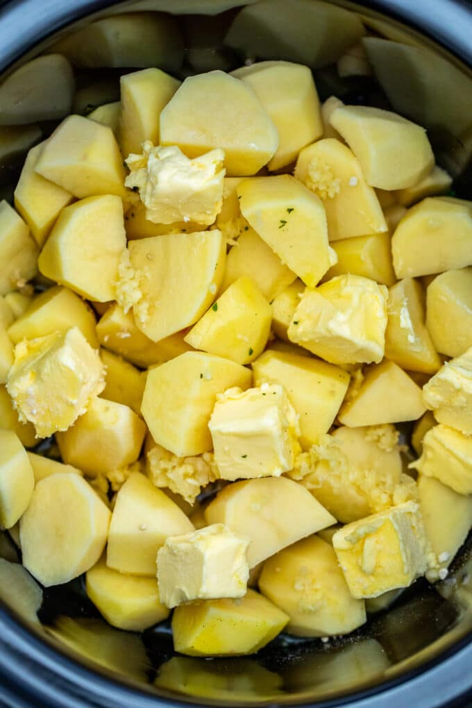 Chopped potatoes with butter in the slow cooker