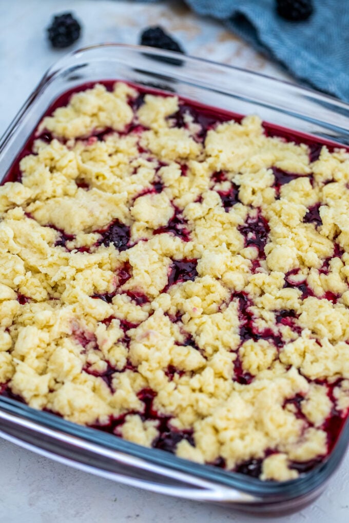 Blackberry Cobbler is a sweet and comforting dessert made with juicy berries and topped with buttery biscuit dough. #cobbler #blackberry #summerrecipes #sweetandsavorymeals #blackberrycobbler