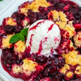 Blackberry Cobbler is a sweet and comforting dessert made with juicy berries and topped with buttery biscuit dough. #cobbler #blackberry #summerrecipes #sweetandsavorymeals #blackberrycobbler