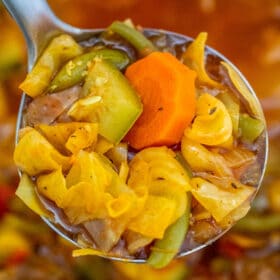 Cabbage Soup is perfect for the cold weather! It is filling but low in calories, just the perfect recipe for those on a diet or trying to lose weight! #soup #souprecipe #cabbagesoup #sweetandsavorymeals #healthyrecipes