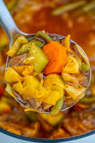 Cabbage Soup is perfect for the cold weather! It is filling but low in calories, just the perfect recipe for those on a diet or trying to lose weight! #soup #souprecipe #cabbagesoup #sweetandsavorymeals #healthyrecipes