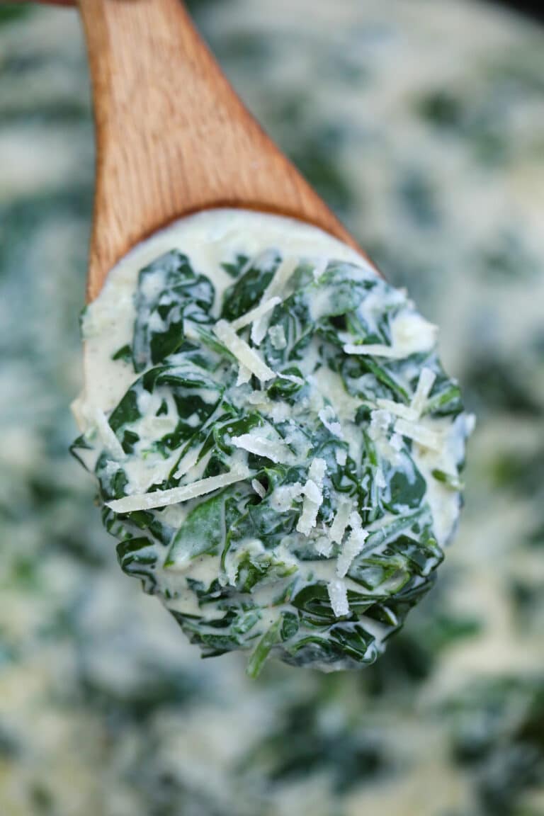 Creamed Spinach is creamy and cheesy making it a delectable side dish to savory entrees! It is a nice take on the leafy green that even kids will love! #spinach #creamedspinach #sidedish #thanksgiving #sweetandsavorymeals