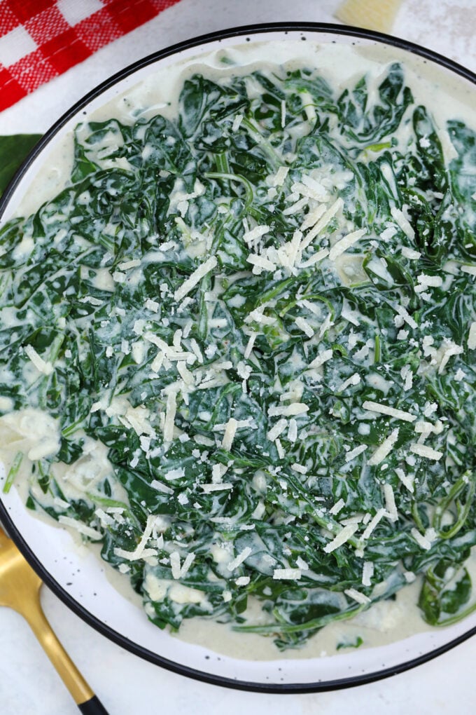 Creamed Spinach is creamy and cheesy making it a delectable side dish to savory entrees! It is a nice take on the leafy green that even kids will love! #spinach #creamedspinach #sidedish #thanksgiving #sweetandsavorymeals