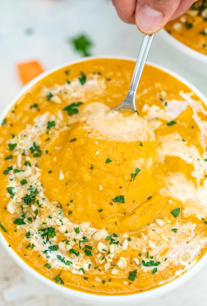 Creamy sweet potato soup in a white bowl