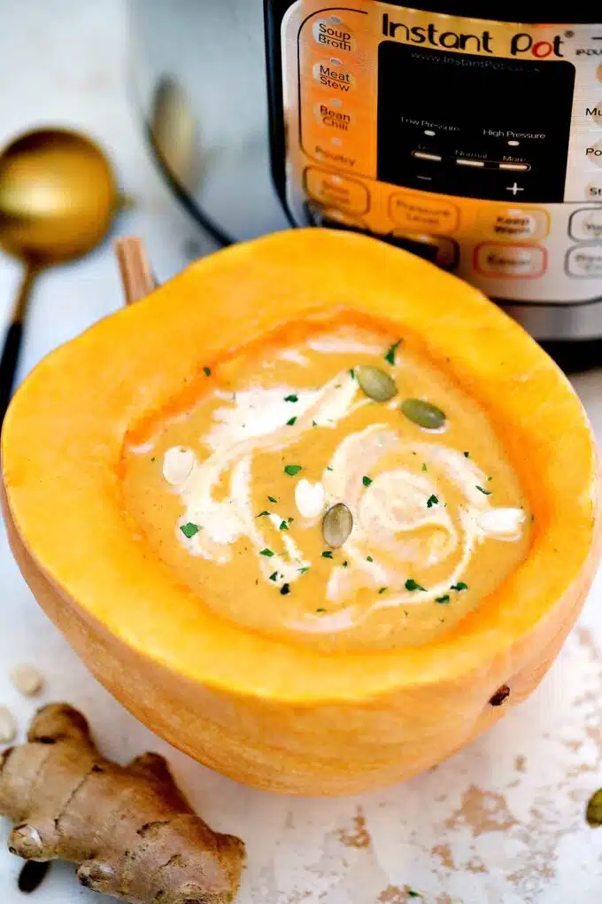 pumpkin soup served in a craved pumpkin